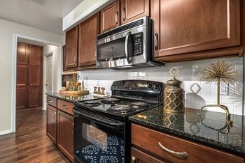 Granite countertops and tile backsplash